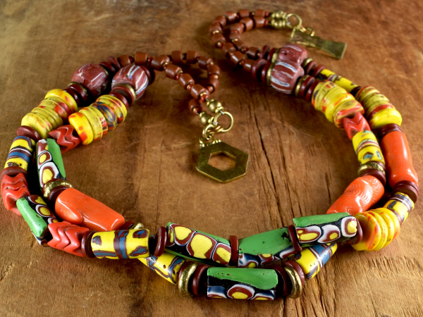 Millefiori trade beads and orange coral in a beaded necklace from Gloria Ewing.