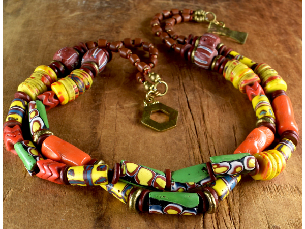 Millefiori trade beads and orange coral in a beaded necklace from Gloria Ewing.