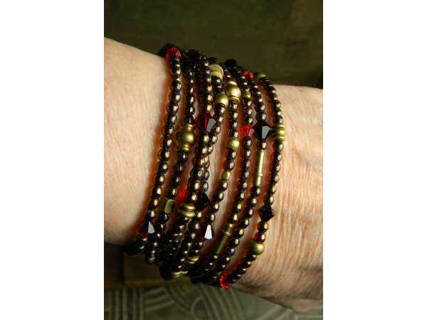Bohemian multi-strand bracelet design in garnet red.