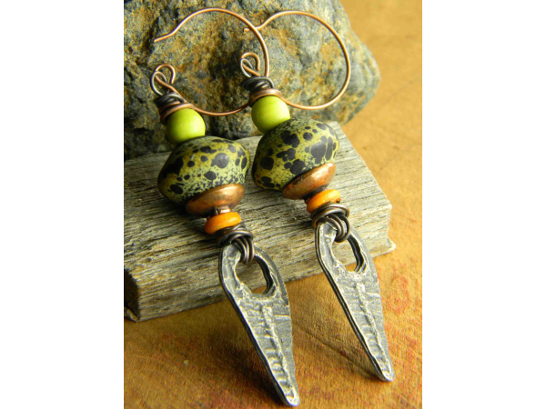 Colorful statement earrings with tribal charm by Gloria Ewing.