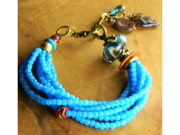 Colorful multi-strand boho bracelet by Gloria Ewing.