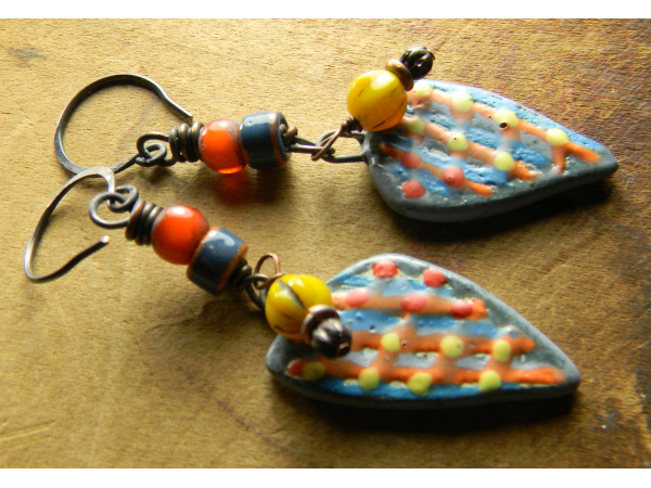 Asymmetrical shard earrings with colorful beads by Gloria Ewing.