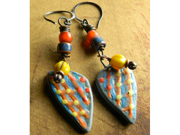 Ethnic style beaded earrings with orange white hearts by Gloria Ewing.