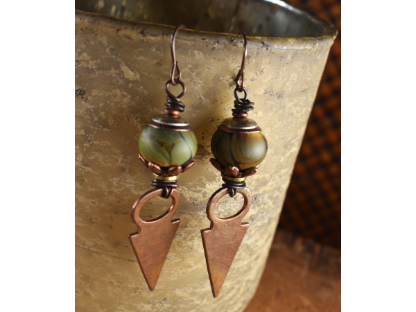 Green lampwork glass with hammered copper by Gloria Ewing.