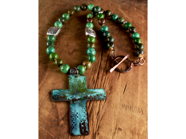 Patina cross necklace with turquoise by Gloria Ewing.