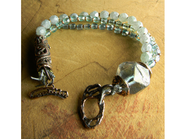 Multi-strand pale green bracelet design by Gloria Ewing.