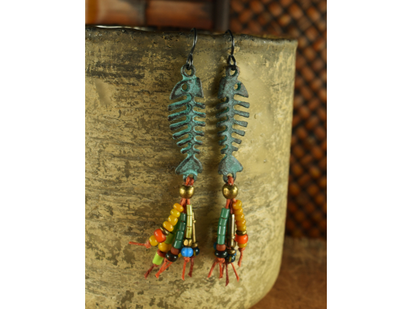 Patina fish skeleton with beaded fringe by Gloria Ewing.