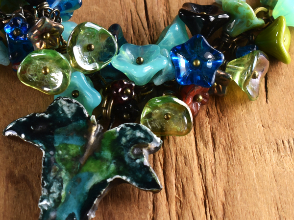 Choker length cluster of flowers, necklace by Gloria Ewing.