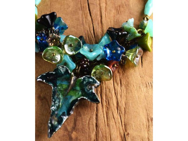 Choker length cluster of flowers, necklace by Gloria Ewing.