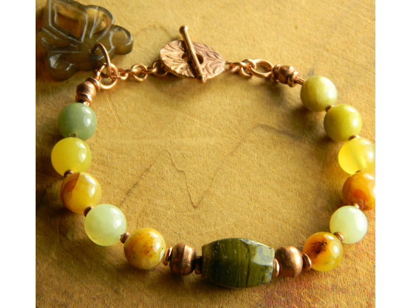 Beautiful greens with copper in this bracelet by Gloria Ewing.