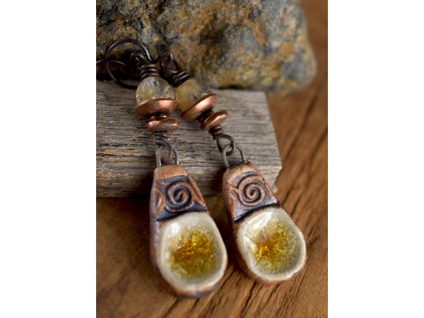 Faceted gold rutile with artisan ceramic earring design by Gloria Ewing.