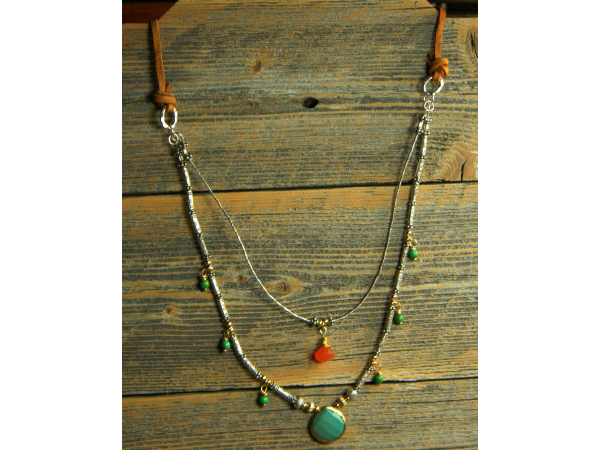 Mixed silver and gold with carnelian by Gloria Ewing.