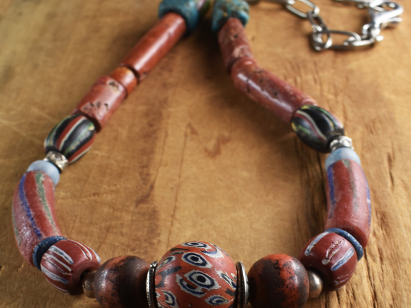 Color palette of red clay and black, design by Gloria Ewing.