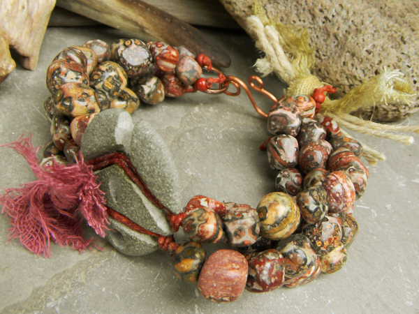 Jasper nuggets with fiber accents in a rustic bracelet by Gloria Ewing.