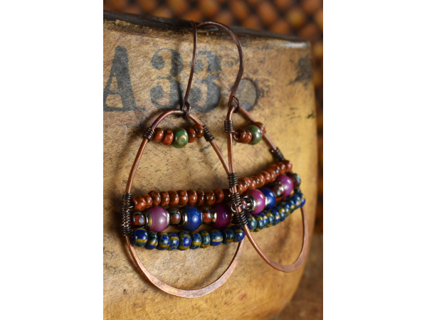 Richly colored bead woven hoop earrings by Gloria Ewing.
