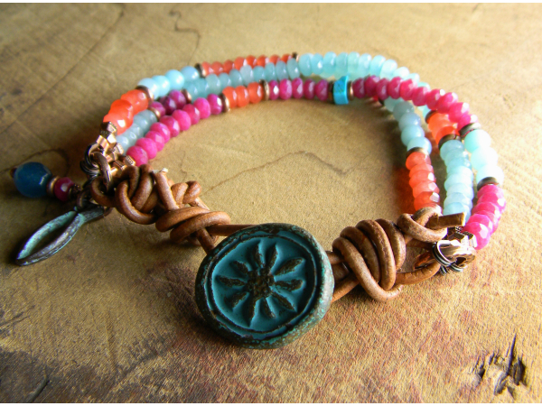 Faceted gemstone bracelet with flower button by Gloria Ewing.