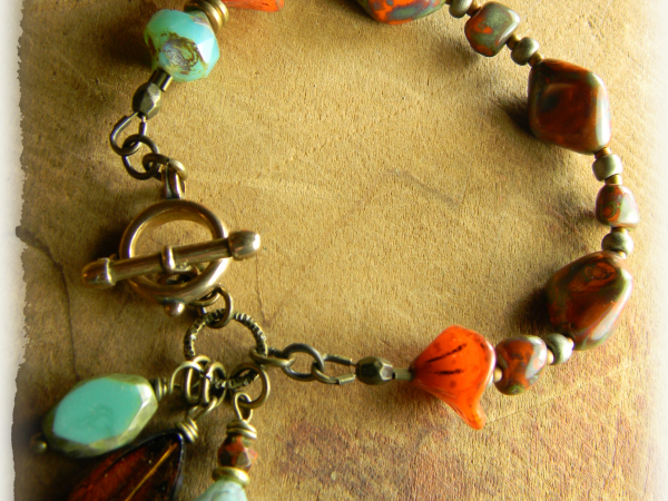Rustic orange and aqua beaded bracelet design by Gloria Ewing.