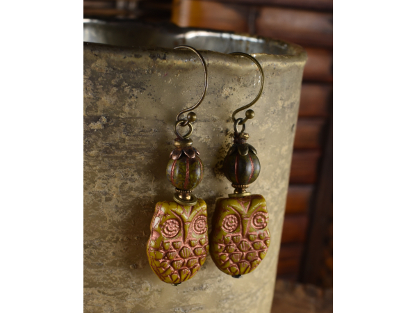 Gold colored owl earrings with brass from Gloria Ewing.