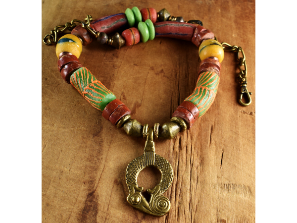 Colorful beaded necklace with brass pendant by Gloria Ewing.