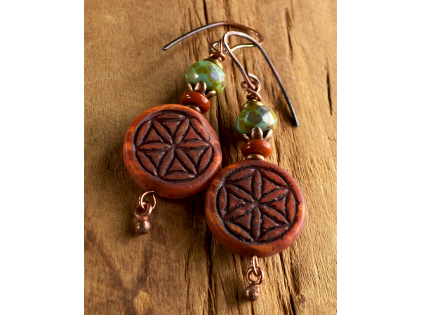 Clay and blue flower of life earrings from Gloria Ewing.
