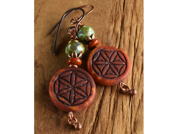 Flower of life earrings in Czech glass and copper by Gloria Ewing.