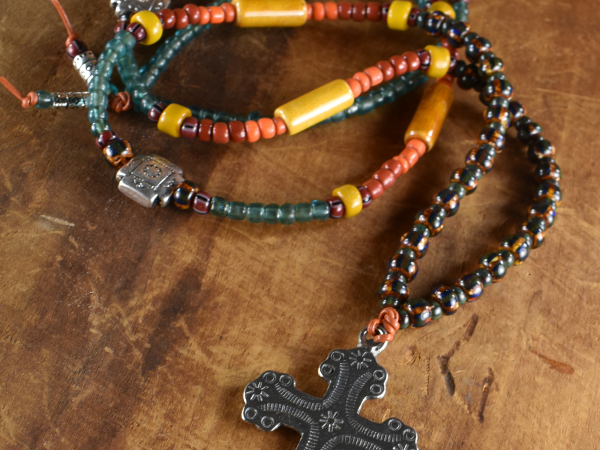 Wild and free as the colors in a long beaded necklace by Gloria Ewing.