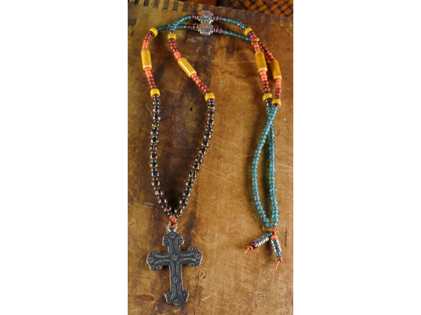 Unique design featuring a southwestern cross pendant by Gloria Ewing.