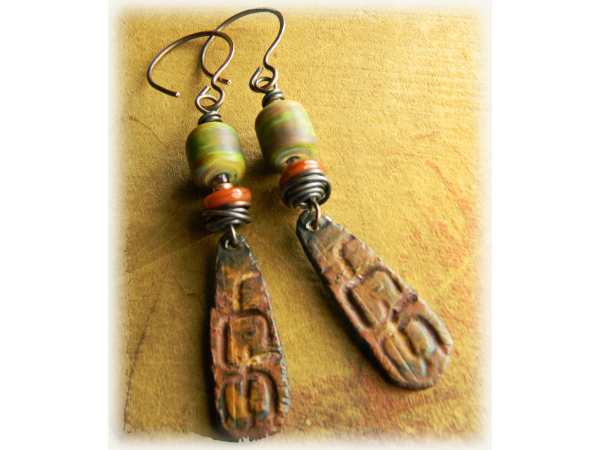 Lampwork and pewter earrings by Gloria Ewing.
