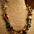 Twisted Czech Beaded Necklace Choker length beaded design in earth tones by Gloria Ewing.