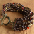 Nine strand beaded bracelet with brass from Gloria Ewing.