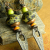 Colorful statement earrings with tribal charm by Gloria Ewing.