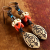 African trade bead earrings with primitive charms by Gloria Ewing.