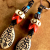 Artisan ceramic, African glass and bone earrings by Gloria Ewing.