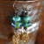 Blue and green lampwork glass with fish charms by Gloria Ewing.