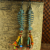 Patina fish skeleton with beaded fringe by Gloria Ewing.