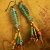 Fun and funky fish skeleton earrings with fringe by Gloria Ewing.