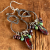 Boho style beaded dangle earrings by Gloria Ewing.