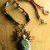 Artisan ceramic goddess beaded necklace by Gloria Ewing.