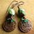 Rustic copper wire wrap, and faceted green stones by Gloria Ewing.