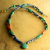 A mix of African beads with green turquoise by Gloria Ewing.