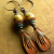 Faceted agate with rustic charms in earrings by Gloria Ewing.