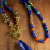 Long Lapis Lazuli Necklace Colorful blend of lapis and coral with brass by Gloria Ewing.