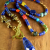 Long pendant necklace with colorful lapis and coral from Gloria Ewing.