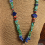 Colorful beaded necklace with lapis lazuli pendant by Gloria Ewing.