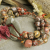 Carved Stone Bracelet with Leopard Jasper Jasper nuggets with fiber accents in a rustic bracelet by Gloria Ewing.