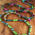Wildly colorful wrap necklace by Gloria Ewing.