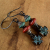 Aged look Mykonos earrings with coral and turquoise from Gloria Ewing.