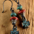 Rustic coral and turquoise with aged cross dangle earrings.