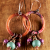 Artisan copper hoops with Mykonos dangles from Gloria Ewing.