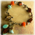 Rustic orange and aqua beaded bracelet design by Gloria Ewing.